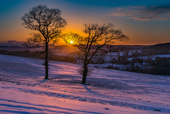 Sunset over Whitbarrow and snowy filed